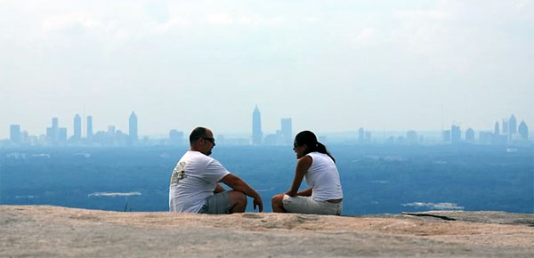 A pair of hikers rest atop Stone Mountain. Photo courtesy Pokie on Outdoor Photographer Forums.